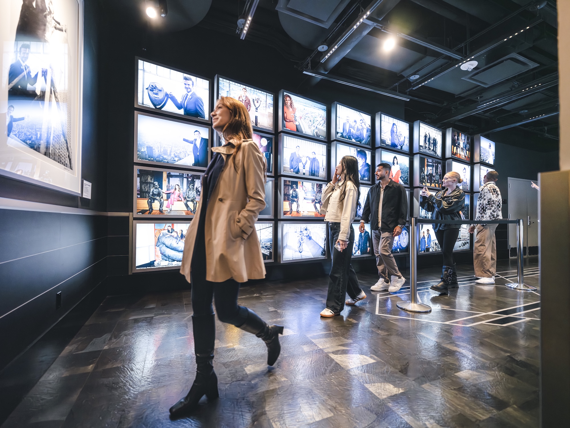 People going through the Empire State Building's museum experience on the 2nd floor