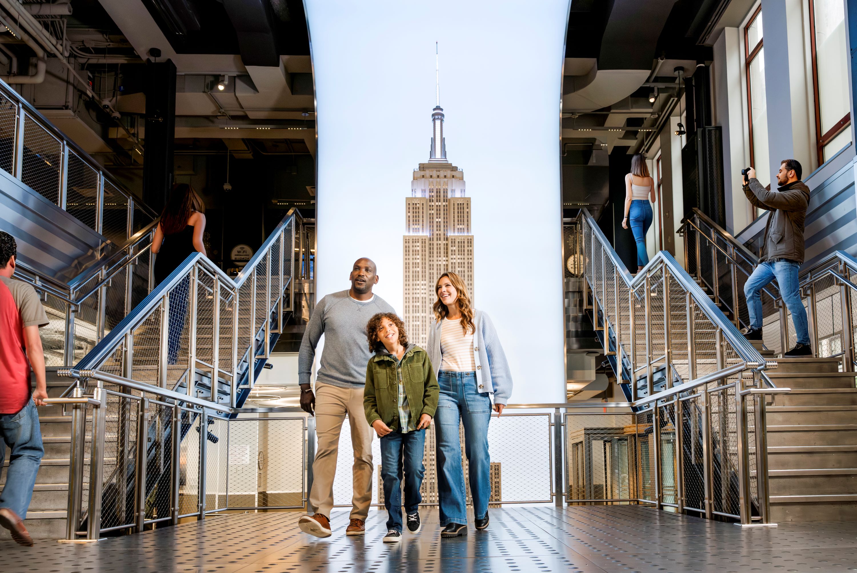 Family at the Grand Staircase of the Empire State Building Observatory.